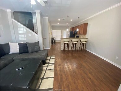 Living room with recessed lighting, dark wood-type