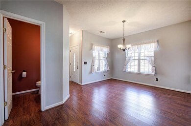 Dining room with a chandelier and LVP floors