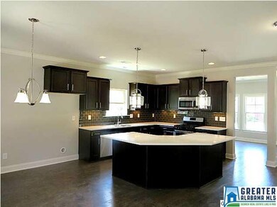 Gourmet Kitchen Features Espresso Cabinets, Quartz