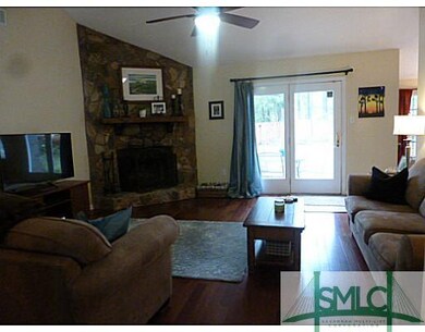 Living Room. Brazlian cherry floors and french doo