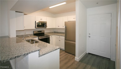 Kitchen featuring appliances with stainless steel