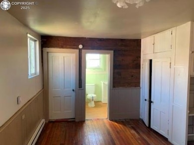 Primary bedroom with hardwood flooring and private 3/4 bath with claw foot tub!