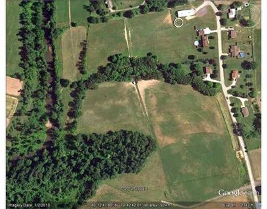 Aerial View. White line at bottom is driveway to t