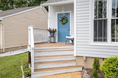 View of exterior entry with a deck