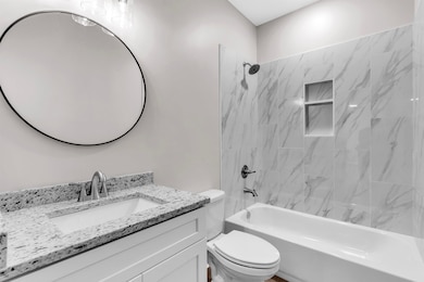 Full bath with shower / washtub combination and vanity