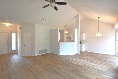 Unfurnished living room featuring ceiling fan, hi