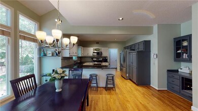 Breakfast Room has floor to ceiling windows for am