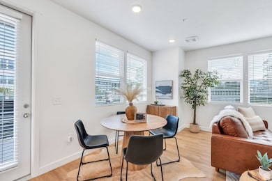 Dining room featuring plenty of natural light, light wood-style flooring, and recessed lighting