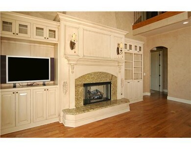 Living Room. BEAUTIFUL CUSTOM BUILT IN S,GRANITE SURROUND FIREPLACE