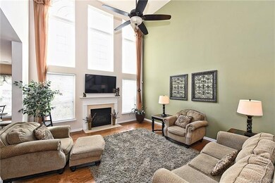 Large two story great room with an abundance of na