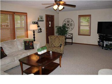 Notice the wood blinds included with home