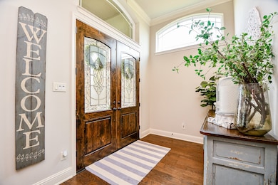 Step through the elegant front door into a grand e