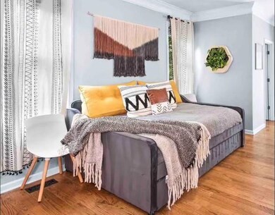 Bedroom featuring hardwood / wood-style flooring a
