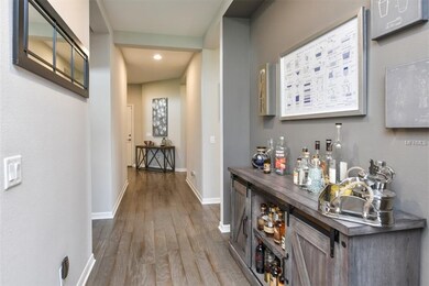 hallway entrance into the great room/kitchen/dinin