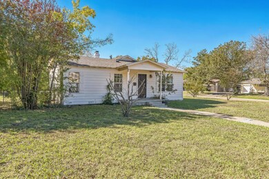 View of front of property with a front lawn
