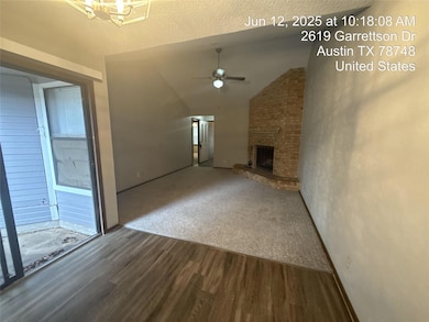 Unfurnished living room featuring dark wood-type 