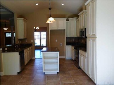 Kitchen with ivory cabinets/cinnamon glaze, granite counters, tile on a brick pattern, stainless appliances