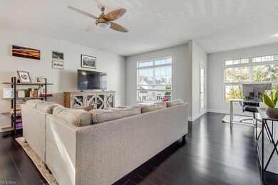 Living room featuring a textured ceiling, ceiling 