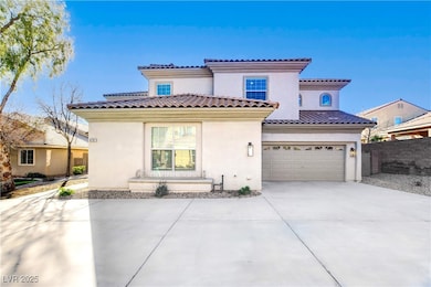 Mediterranean / spanish-style home featuring concr