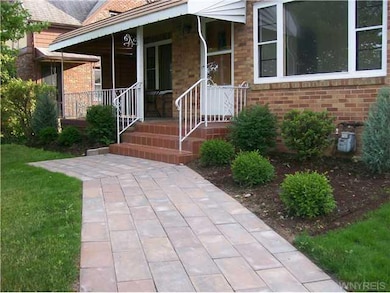 Exterior Front New stone walkway and landscaping;