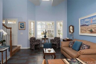Grand entry with double doors leads into light and