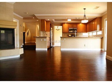 Property Photo. FAMILY ROOM LOOKING INTO KITHCHEN