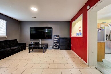 Living room with light tile floors