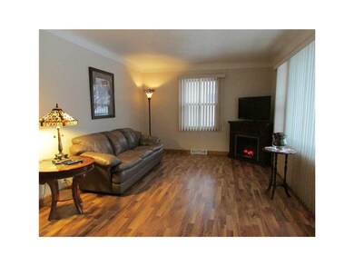 Living Room. Living room has cove ceiling and new 