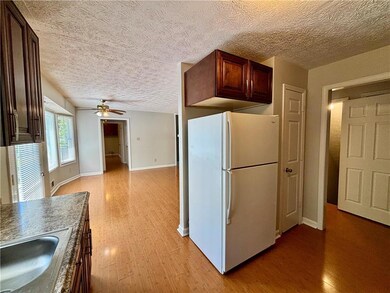 Kitchen with a ceiling fan, a sink, freestanding r