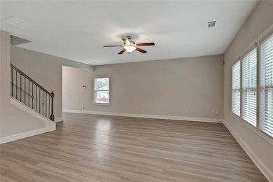 Spare room featuring light wood-type flooring and 