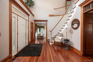 View from dining room through foyer into formal li