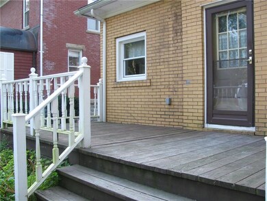 REAR ENTRY TO FIRST FLOOR APARTMENT/NICE DECK