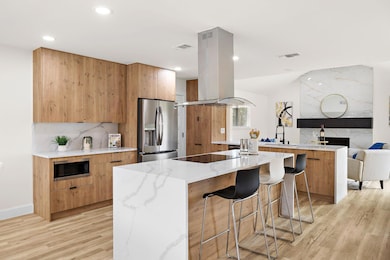 Kitchen featuring appliances with stainless steel