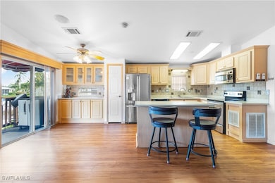 Kitchen with decorative backsplash, stainless stee
