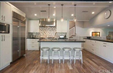 View from outdoor lanai into kitchen showing off n