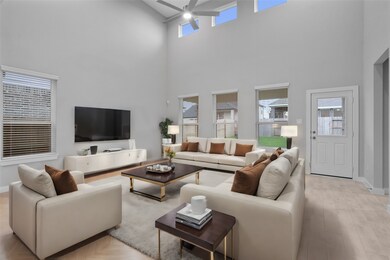 This living room is a perfect room! Featuring custom paint, soaring high ceiling, recessed lighting, ceiling fan, and an amazing wall of windows providing a plenty of natural lighting!