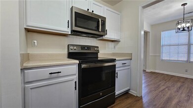 Kitchen featuring electric range, stainless steel 