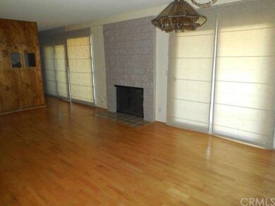 Main living area with fireplace and enclosed patio