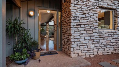 Property entrance featuring board and batten sidi