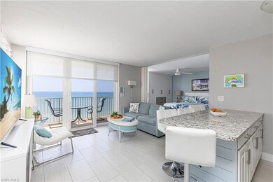 Living area with ceiling fan and floor to ceiling 