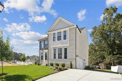 View of front facade featuring a garage and a fron