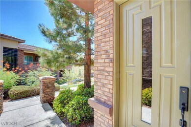 Doorway to property featuring brick siding and stone siding