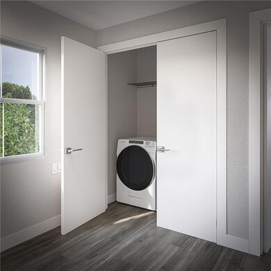 Clothes washing area featuring washer / clothes dr
