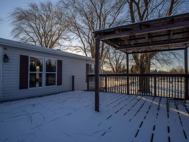 The huge deck off the living room features a cover