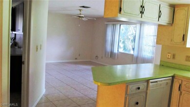 Family room has a nice view onto the lanai through glass sliders. Laundry room on the left.