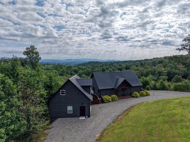 View from above of property with a heavily wooded area