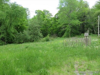 16 acres partly wooded land