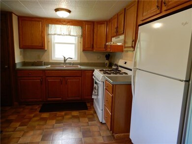 Kitchen has a pantry closet on the left side of th