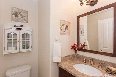 A main floor half bath has been remodeled with mar