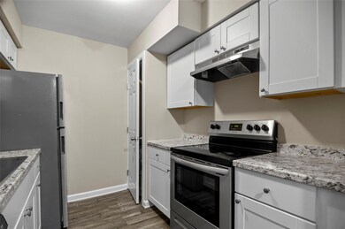 Kitchen with granite countertops, appliances with 